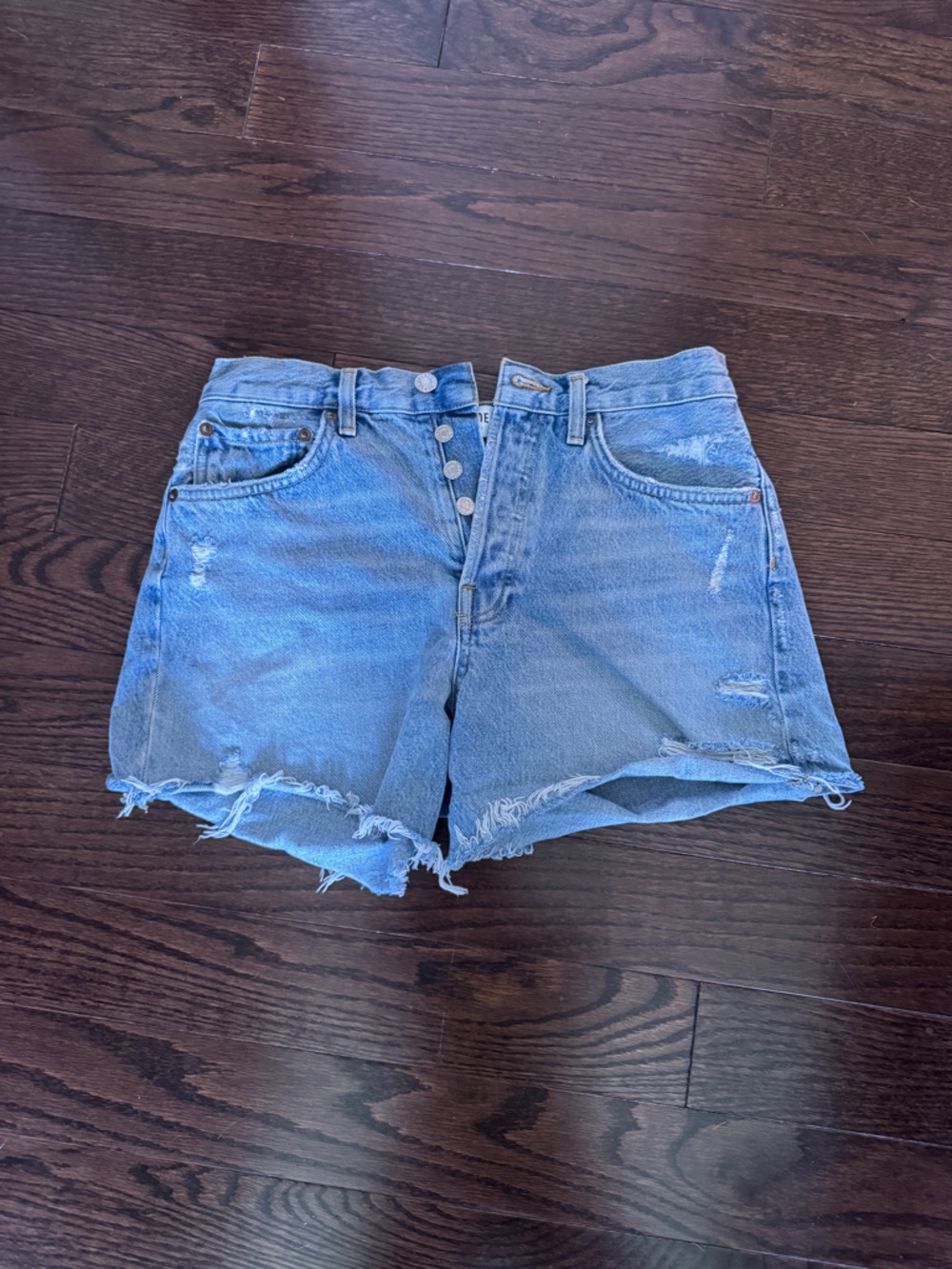 Agolde Distressed Light Blue Denim Button-Front Shorts